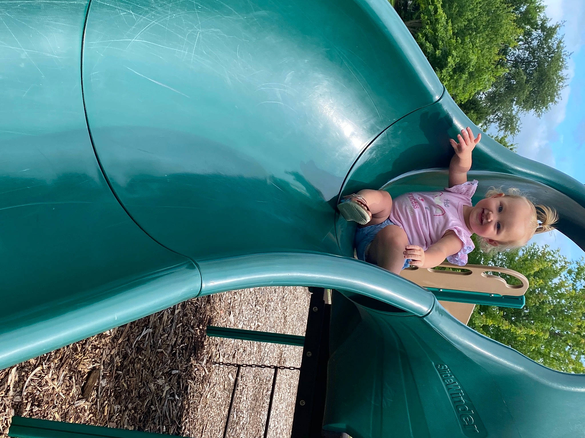 Mia Elizabeth joined the competition — help win amazing prizes! aqua, auto_part, automotive_exterior, automotive_tire, azure, blue, bumper, chute, electric_blue, fender, fun, grass, green, joy, leisure, motor_vehicle, outdoor_play_equipment, person, plant, playground