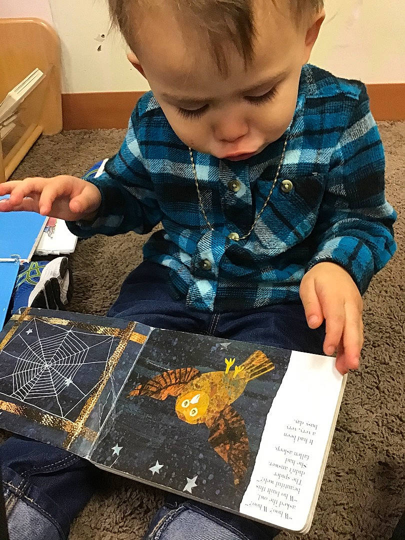Zephaniah is registered to the contest to win money with this photo: baby, baby_toddler_clothing, book, child, curious, denim, kitchen_utensil, learning, mouth, nose, office_supplies, person, play, pocket, toddler