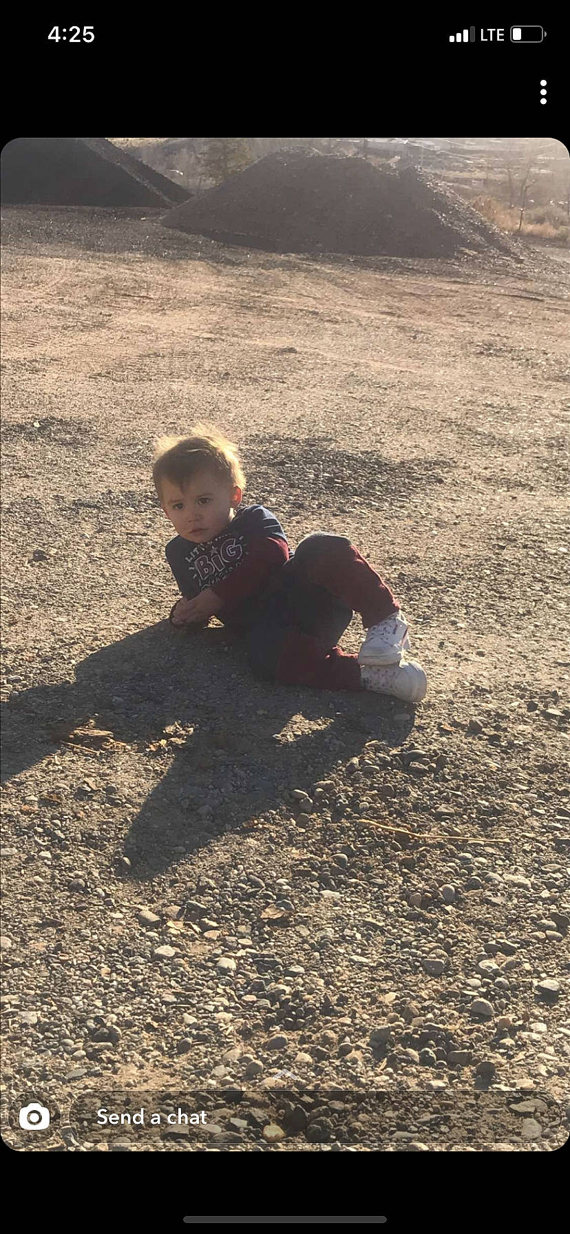 Zephaniah is registered to the contest to win money with this photo: baby, baby_toddler_clothing, person, play, sand, shadow, soil, toddler, walking_shoe