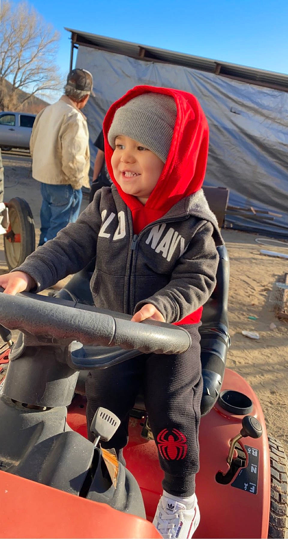 Zephaniah joined the competition — help win amazing prizes! beanie, bonnet, cannon, headwear, hood, hoodie, jacket, joy, lap, mouth, person, sneakers, tarpaulin, winter