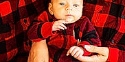 Evren is registered to the contest to win money with this photo: baby, child, infant, family, plaid, red_and_black, matching_outfits, hands, jeans, ripped_jeans, person, casual_clothing, indoor, portrait, smiling, closeup, holding, cozy, cute, warm