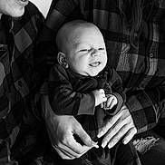 Evren joined the competition — help win amazing prizes! baby, adult, black_and_white, plaid_shirt, smiling, portrait, hands, holding, family, happy, infant, clothing, face, person, closeup, casual, indoors, people, love, togetherness