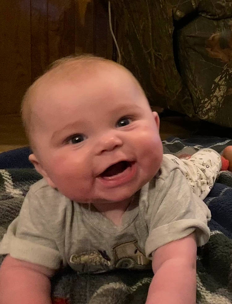 Shooter is registered to the contest to win money with this photo: baby, baby_toddler_clothing, cheek, child, eye, facial_expression, finger, fun, hair, happy, iris, mouth, nose, person, skin, sleeve, smile, thumb, toddler, tooth