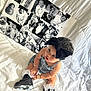 Hermoni is registered to the contest to win money with this photo: toddler, child, baby, headband, denim, sneakers, white_bedspread, black_and_white_photos, collage, jewelry, bracelet, necklace, curly_hair, sitting, indoors, portrait, cute, playful, expression, footwear