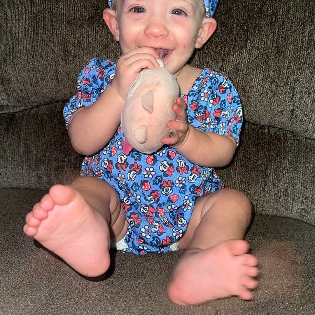 Marleigh Grace joined the competition — help win amazing prizes! baby, baseballcap, bodypart, cap, clothing, couch, cushion, face, finger, furniture, hand, hat, head, homedecor, pants, person, photography, portrait, shorts, sitting