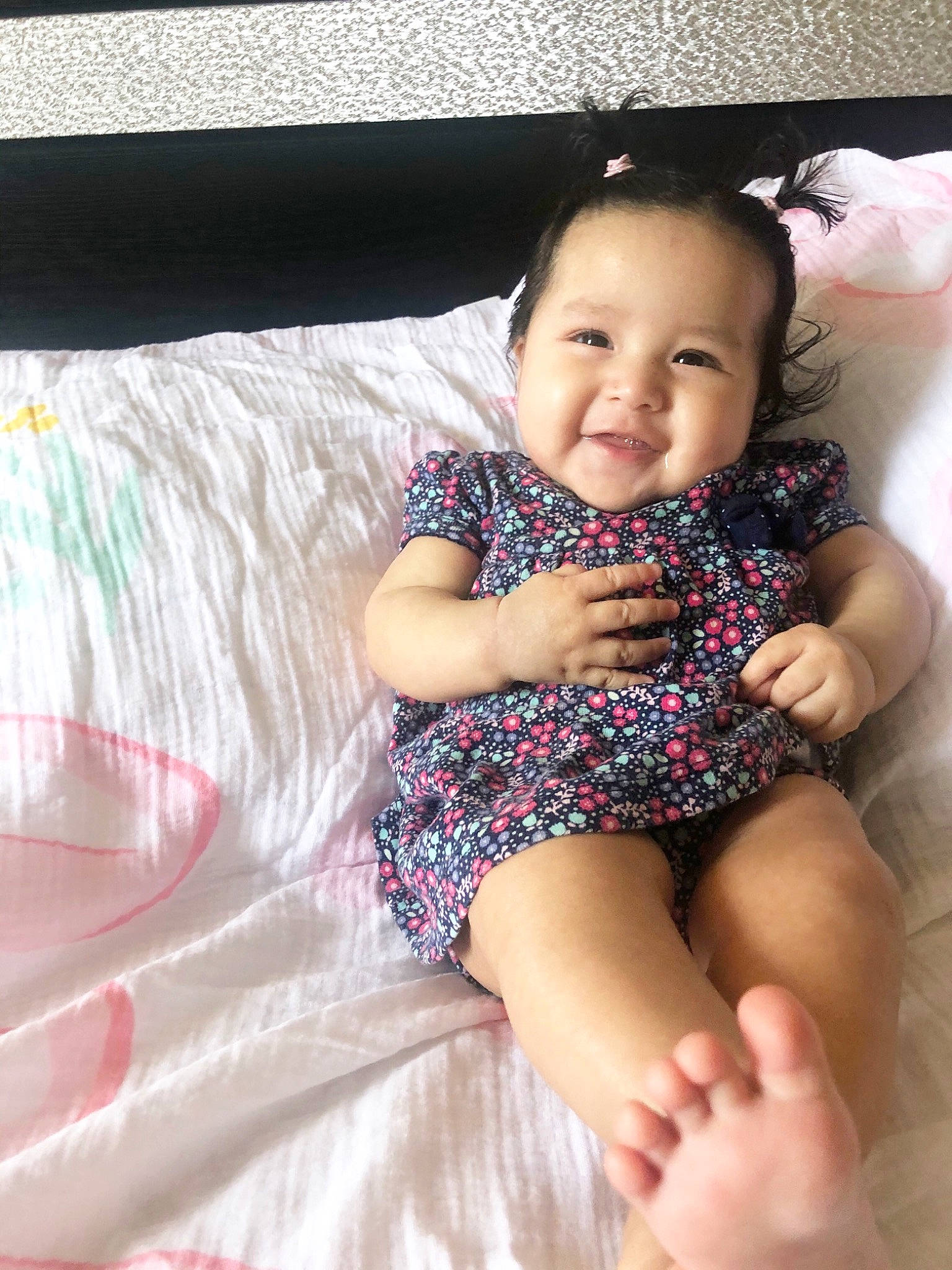 Andrea is registered to the contest to win money with this photo: baby, baby_toddler_clothing, cheek, comfort, dress, finger, flash_photography, happy, iris, joy, knee, lap, leg, person, pink, skin, smile, textile, thigh, thumb