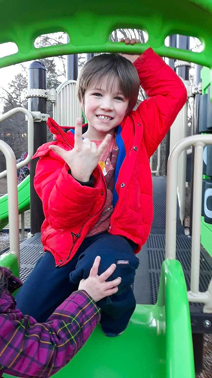 Brayden is registered to the contest to win money with this photo: child, fun, green, joy, outerwear, person, playground, public_space, recreation, skin, smile, snapshot, toddler