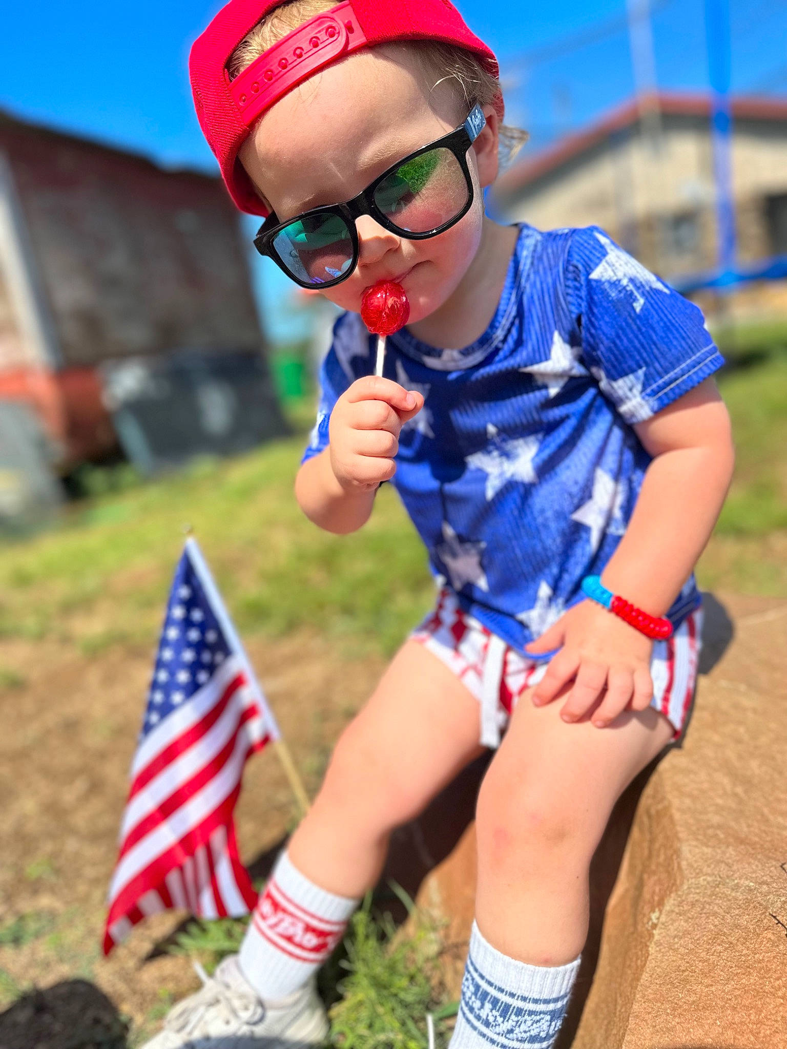 Bellamy joined the competition — help win amazing prizes! blue, child, electric_blue, eyewear, flag, flag_of_the_united_states, fun, glasses, goggles, grass, green, happy, leisure, person, recreation, red, summer, sunglasses, thigh, toddler