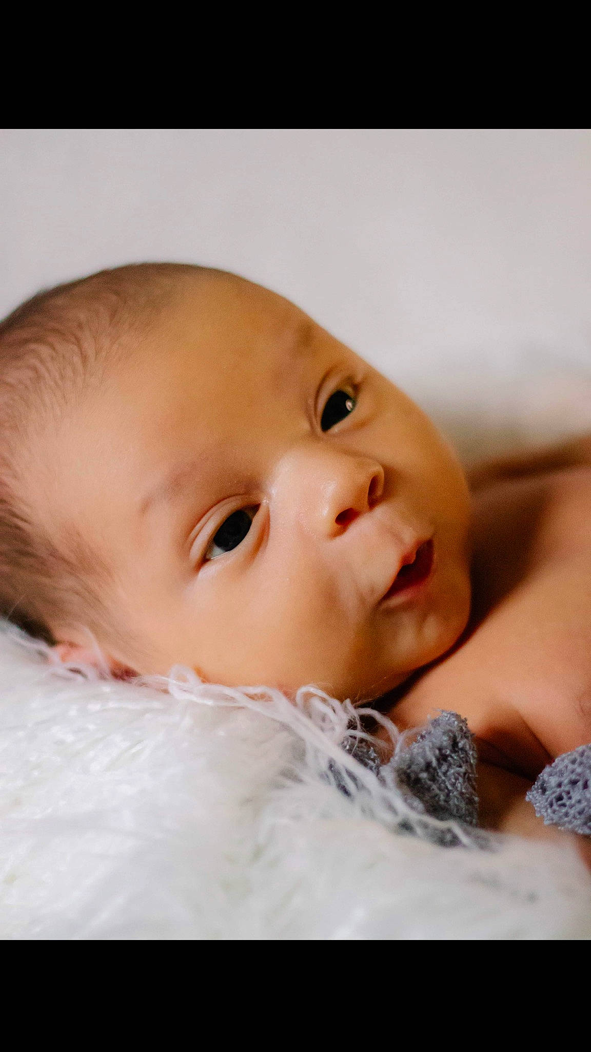 Hezekiah joined the competition — help win amazing prizes! baby, baby_toddler_clothing, cheek, child, chin, comfort, eye, eyebrow, eyelash, face, flash_photography, fur, happy, iris, linens, lip, nose, person, skin, toddler