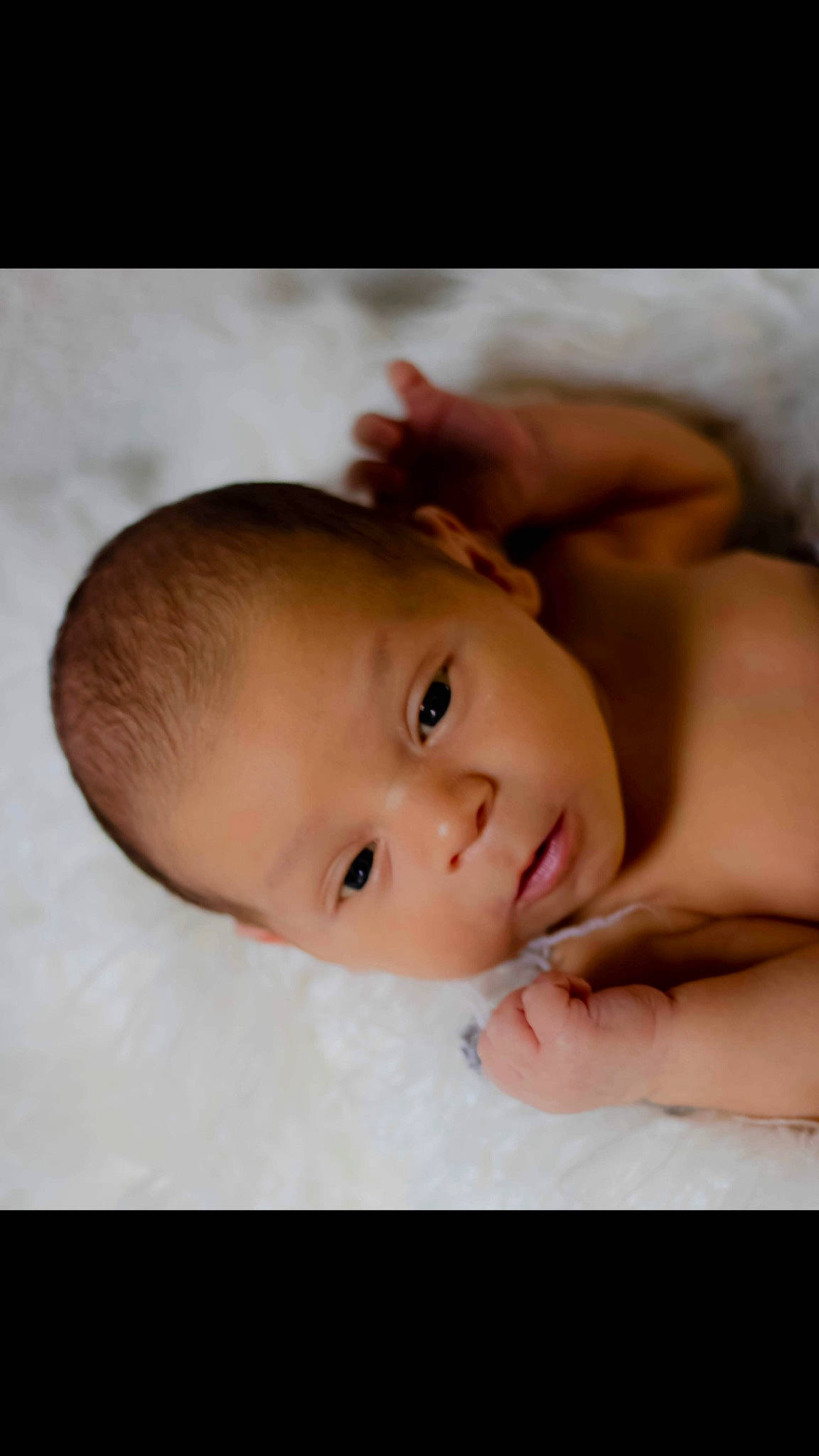 Hezekiah is registered to the contest to win money with this photo: baby, baby_toddler_clothing, cheek, comfort, eye, eyebrow, eyelash, flash_photography, gesture, hair, happy, human_body, iris, lip, mouth, neck, nose, person, skin, thumb