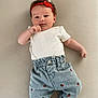 baby, infant, headband, strawberry, jeans, white_shirt, socks, lying_down, cute, child, soft_surface, casual_clothing, small_hands, adorable, portrait, indoor, relaxed, fashion, baby_fashion, headwear