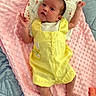 Michaela Rayne joined the competition — help win amazing prizes! awake, baby, baby_clothing, bed, child, cozy, facial_expression, feet, hands, indoor, infant, lying_down, photography, pink_blanket, portrait, quilt, raised_arms, textured_blanket, wide_eyes, yellow_outfit
