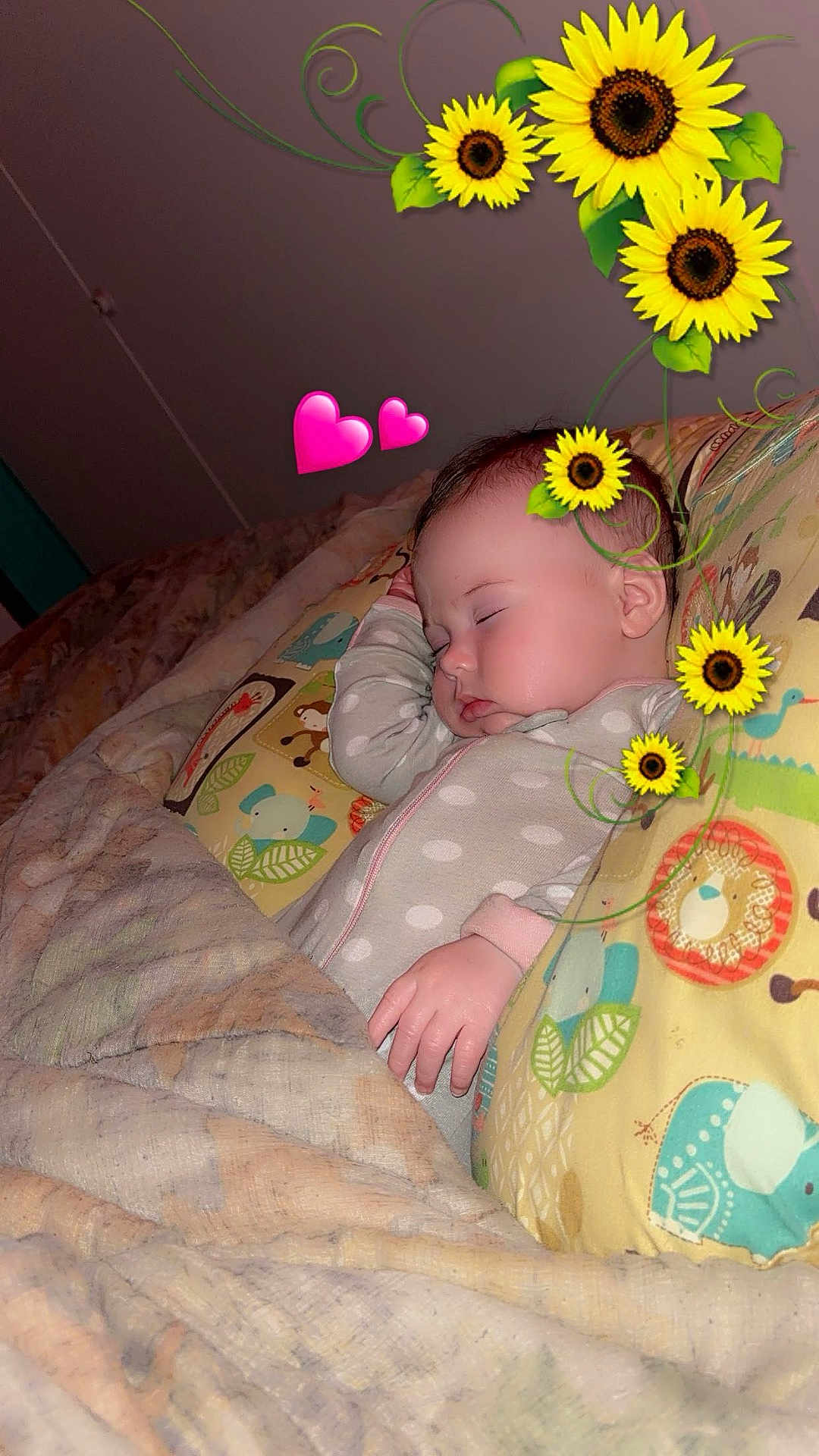 Eliza joined the competition — help win amazing prizes! baby, sleeping, blanket, pillow, sunflower, heart_emoji, polka_dot_pajamas, cute, infant, bedroom, soft_lighting, peaceful, child, resting, indoors, decorative_stickers, animal_print, comfort, toddler, sleep