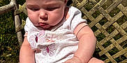 Eliza joined the competition — help win amazing prizes! baby, child, infant, onesie, polka_dot, butterfly, hands, legs, outdoor, sunlight, chair, woven_chair, curious, cute, sitting, grass, skin, daylight, closeup, portrait