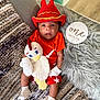 baby, blanket, chicken_toy, child, colorful, cozy, crochet_hat, cute, home_interior, infant, knitted_toy, lying_down, newborn, one_month_sign, orange_clothing, portrait, red_hat, soft_fur, star_pattern, white_socks