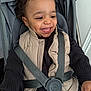 Warenn participe au concours pour gagner de l'argent avec cette photo : toddler, child, smiling, stroller, seatbelt, vest, sweater, curly_hair, happy, baby, cute, infant, sitting, indoors, person, clothing, young_child, face, portrait, baby_boy