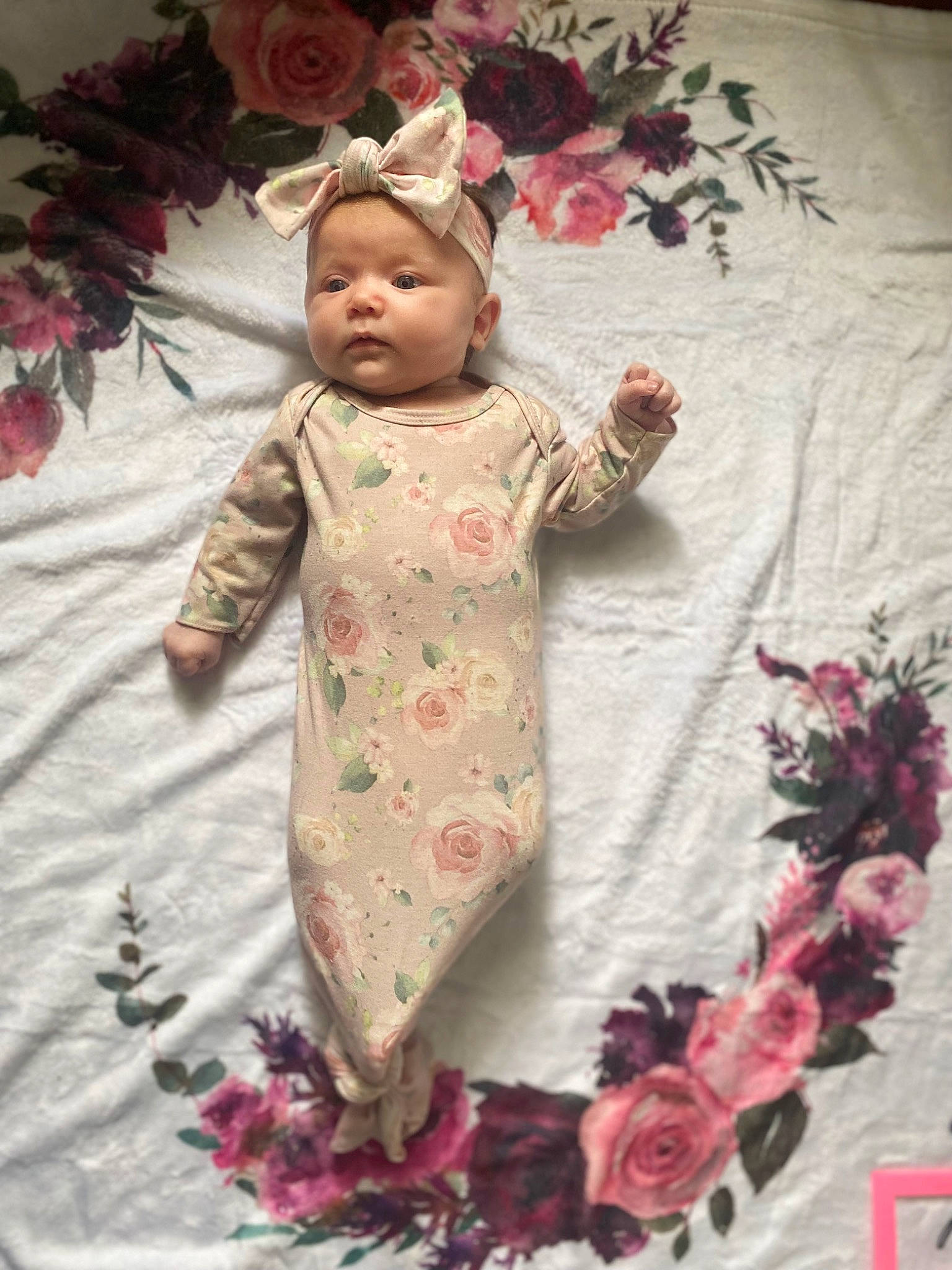 Oakleigh is registered to the contest to win money with this photo: baby, baby_products, baby_toddler_clothing, child, cut_flowers, dress, event, floral_design, flower, flower_arranging, happy, linens, magenta, pattern, peach, person, petal, pink, sleeve, textile