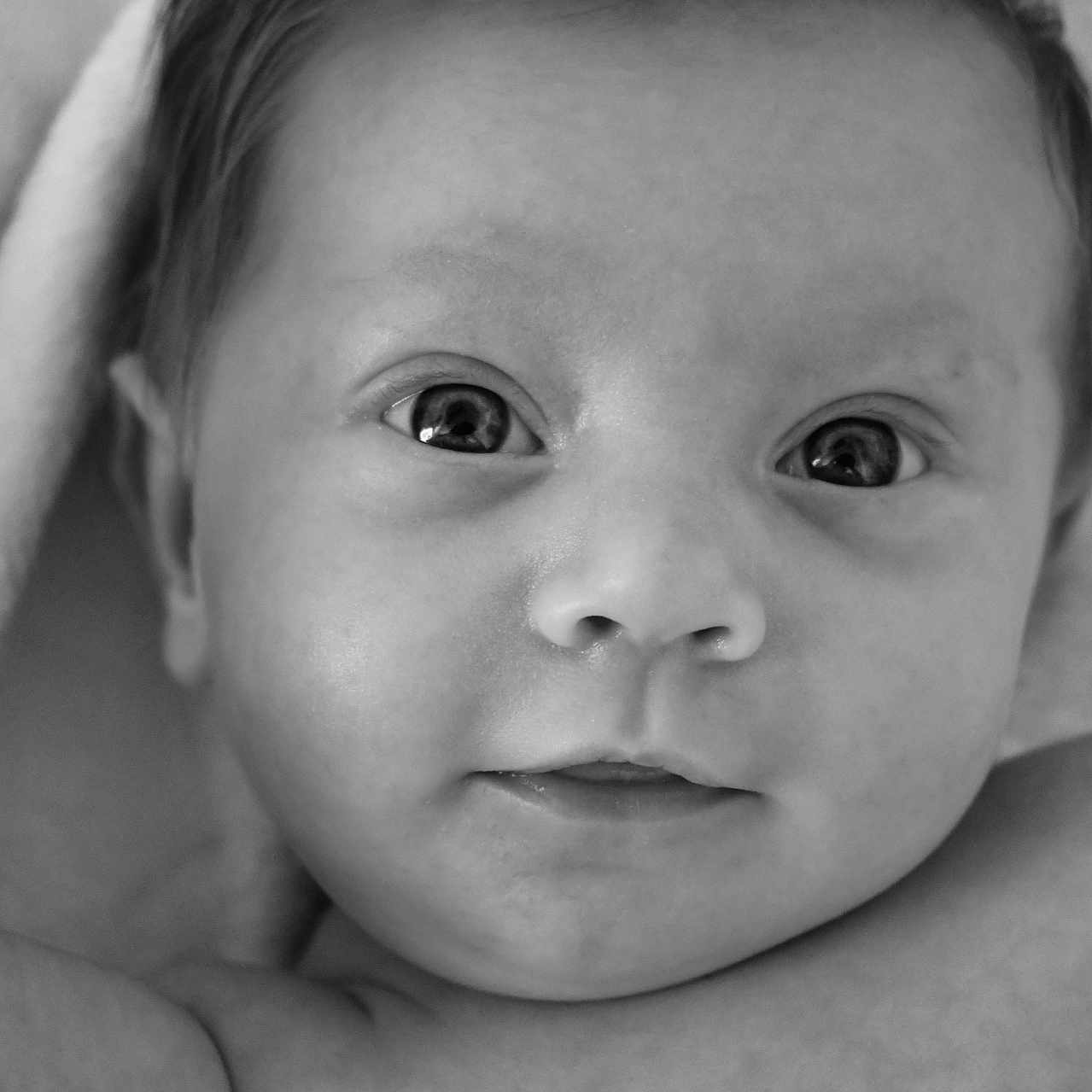 Willow is registered to the contest to win money with this photo: baby, bodypart, face, finger, hand, happy, head, mouth, newborn, person, photography, portrait, smile, towel