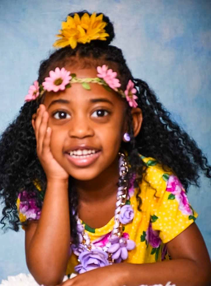 Serenity is registered to the contest to win money with this photo: beauty, black_hair, chin, event, eyebrow, face, fashion_design, flower, fun, happy, headgear, headwear, jewellery, jheri_curl, joy, long_hair, magenta, people, person, purple