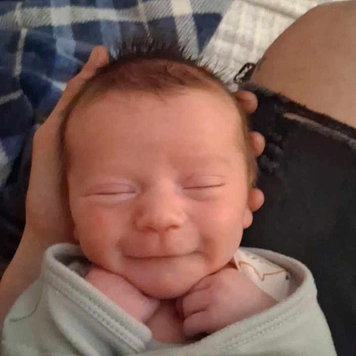 Calvin joined the competition — help win amazing prizes! baby, infant, smile, closed_eyes, blanket, hands, cozy, soft, comfort, person, portrait, resting, cute, newborn, sleeping, clothing, indoor, peaceful, head, skin