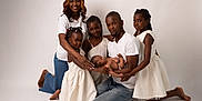 Elhadji a rejoint le concours — aidez-le/la à gagner de superbes lots ! baby, children, diversity, family, father, happy, indoor, jeans, kneeling, love, mother, newborn, parents, people, portrait, posing, smiling, studio, togetherness, white_clothing