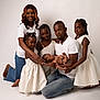baby, children, diversity, family, father, happy, indoor, jeans, kneeling, love, mother, newborn, parents, people, portrait, posing, smiling, studio, togetherness, white_clothing