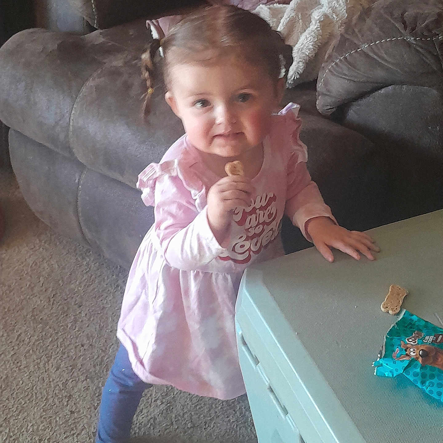 Lily is registered to the contest to win money with this photo: architecture, bodypart, building, child, couch, face, female, finger, food, furniture, girl, hand, head, indoors, livingroom, person, photography, portrait, room, wood