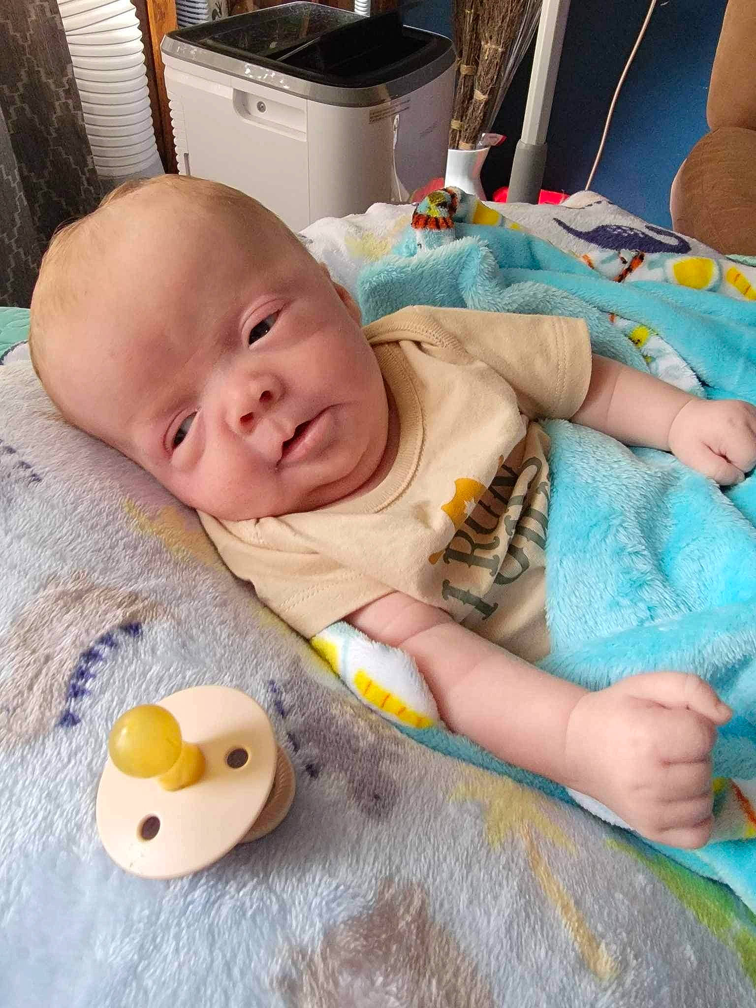 Jaxxon is registered to the contest to win money with this photo: baby, baby_products, baby_sleeping, baby_toddler_clothing, bedtime, cheek, child, comfort, cooktop, flooring, gas_stove, home_appliance, kitchen_appliance, linens, person, product, room, skin, textile, toddler