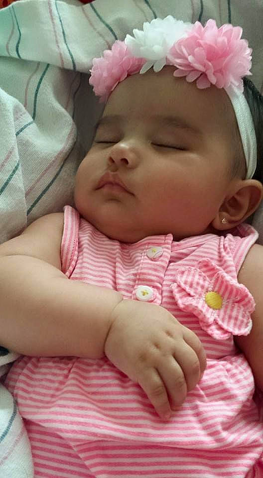 Jaelynn is registered to the contest to win money with this photo: baby, baby_sleeping, cheek, child, close_up, face, hair_accessory, hand, head, headgear, headwear, lip, mouth, nose, person, pink, skin, toddler