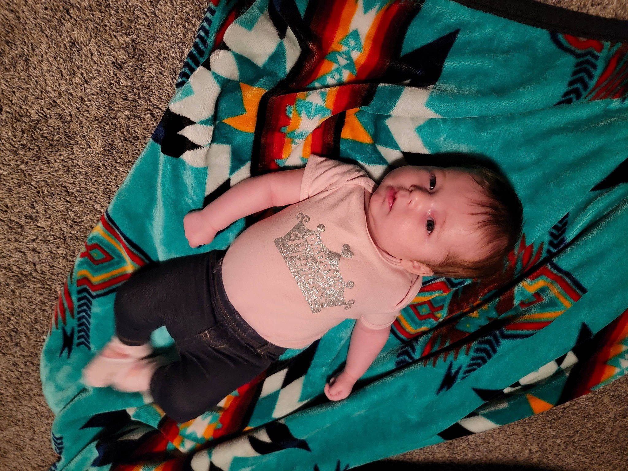 Juliana is registered to the contest to win money with this photo: baby, baby_carriage, baby_products, baby_toddler_clothing, child, comfort, electric_blue, eye, fashion_accessory, grass, happy, head, linens, pattern, person, sitting, sleeve, textile, toddler