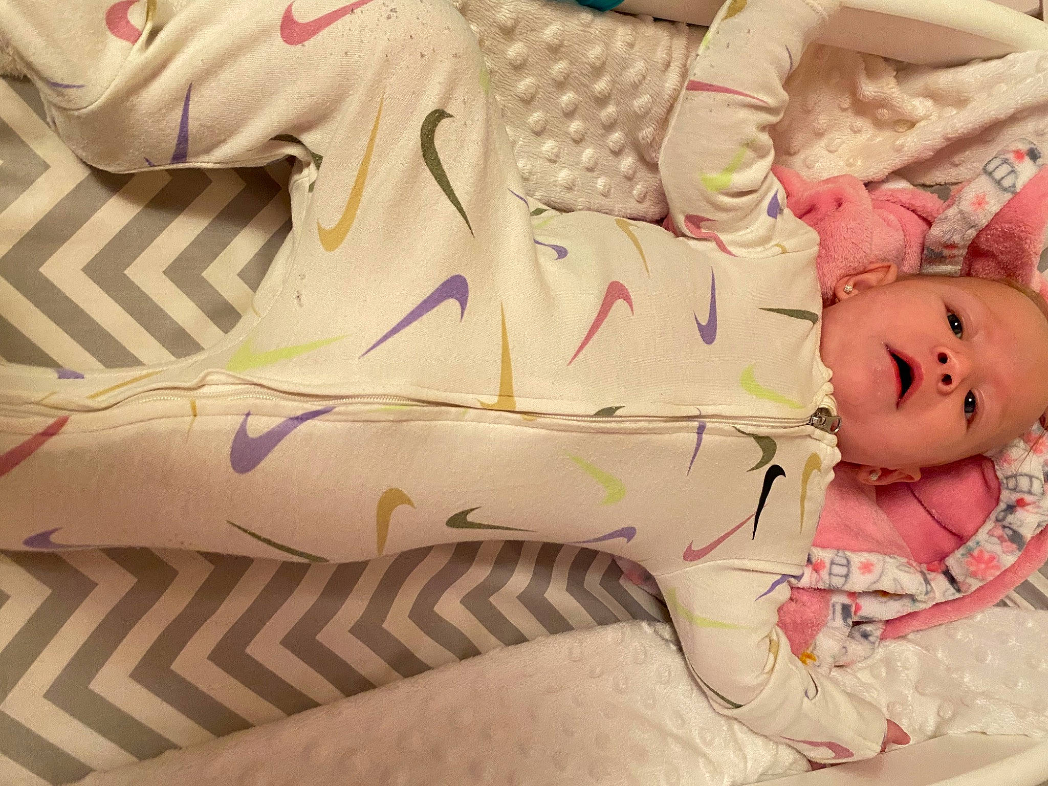 Camila joined the competition — help win amazing prizes! baby, baby_products, baby_toddler_clothing, bed, bed_sheet, bedding, comfort, doll, dress, hand, human_leg, linens, pattern, person, sleeve, stuffed_toy, textile, thigh, toy, white