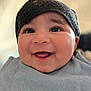 Rayaan is registered to the contest to win money with this photo: baby, smile, face, headwear, bib, happy, closeup, infant, child, cute, cheerful, portrait, skin, eyes, mouth, indoors, soft_light, head, expression, person