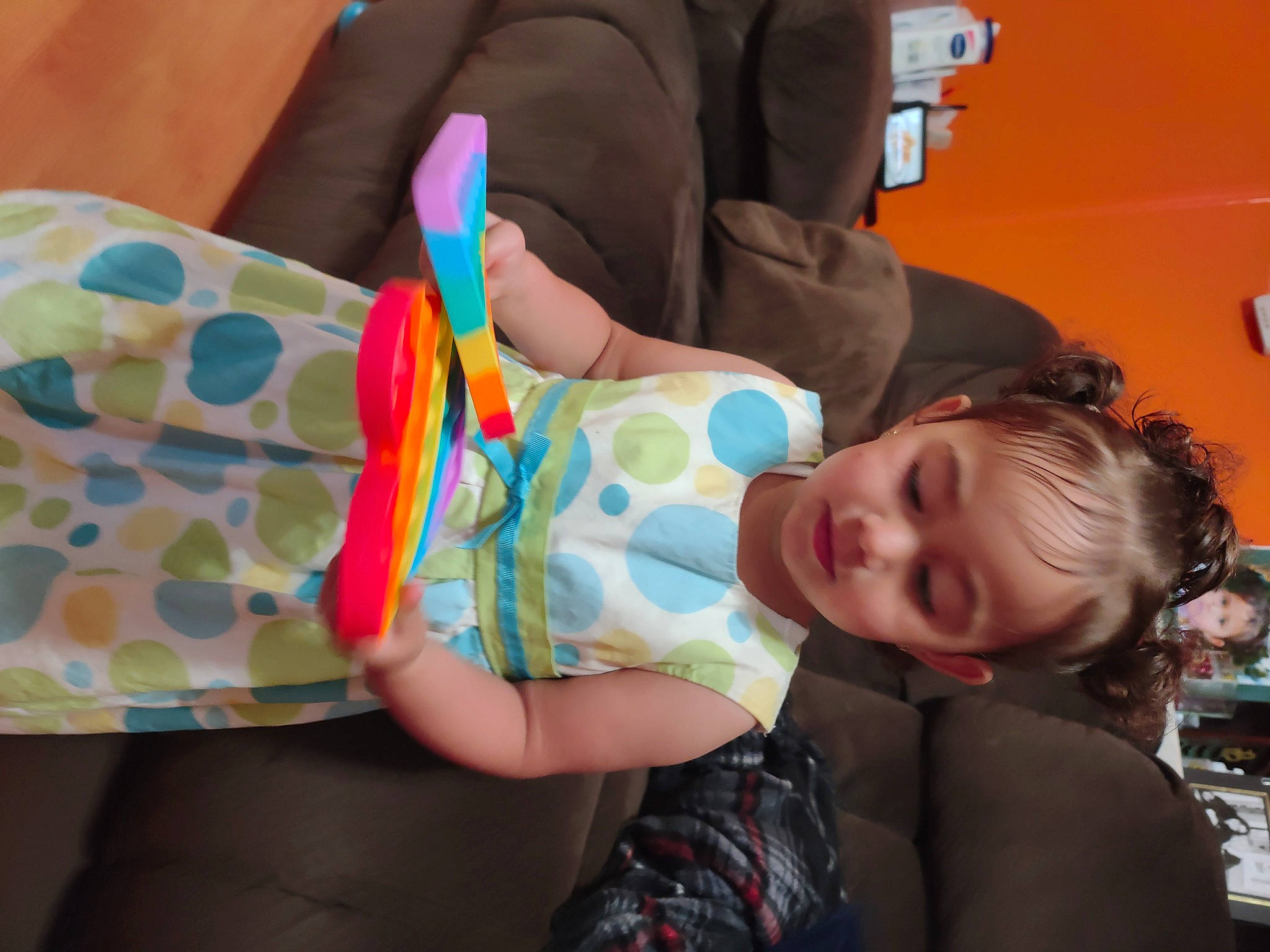 Zah'Kariah joined the competition — help win amazing prizes! baby_products, baby_toddler_clothing, child, comfort, fun, human_leg, leisure, orange, party, pattern, person, play, room, sitting, thigh, toddler