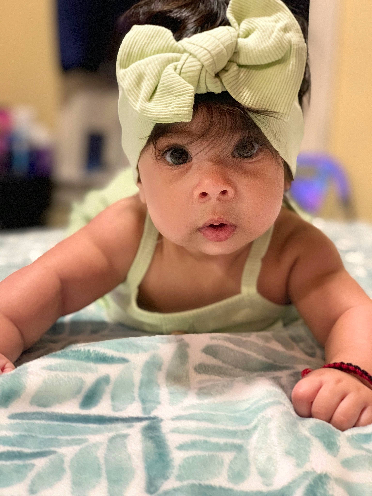 Gianna is registered to the contest to win money with this photo: baby, baby_toddler_clothing, beauty, cap, cheek, child, comfort, face, fashion_accessory, fun, hair_accessory, happy, headgear, headpiece, headwear, linens, pattern, person, room, skin