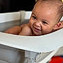 baby, smile, water, bathtub, indoor, child, face, happy, skin, head, hair, droplets, bath, toddler, person, closeup, expression, light, seat, joy