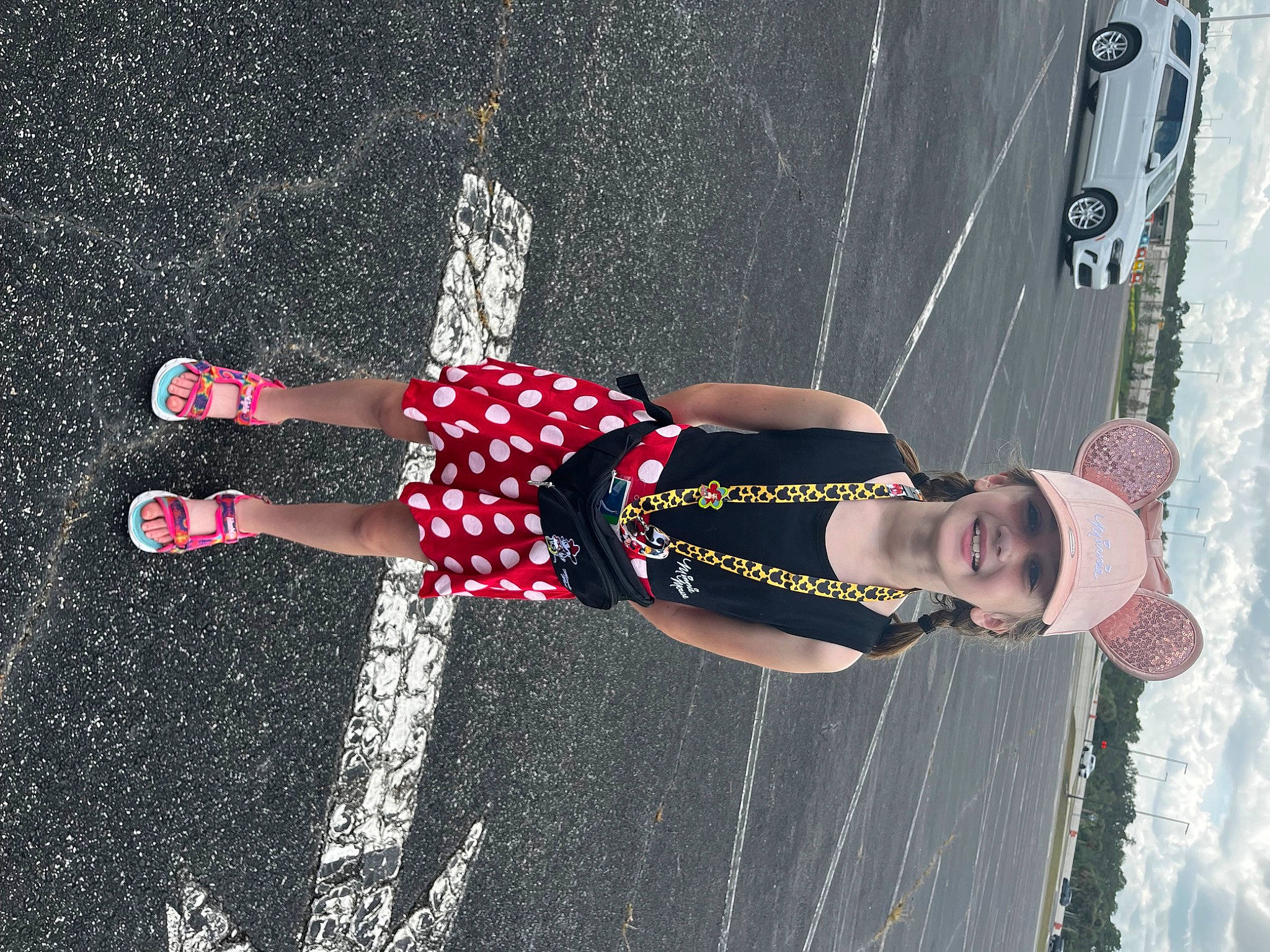 Addyson is registered to the contest to win money with this photo: asphalt, carmine, fun, grass, headwear, human_leg, joy, knee, leisure, pattern, person, recreation, road, road_surface, shadow, sidewalk, sports, sports_uniform, sportswear, textile