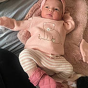 Shantalys is registered to the contest to win money with this photo: adorable, baby, blanket, bow, child, cozy, cute, headband, indoors, infant, knitwear, lying_down, mittens, pink, portrait, small, soft, striped_pants, warm, wearing_clothes