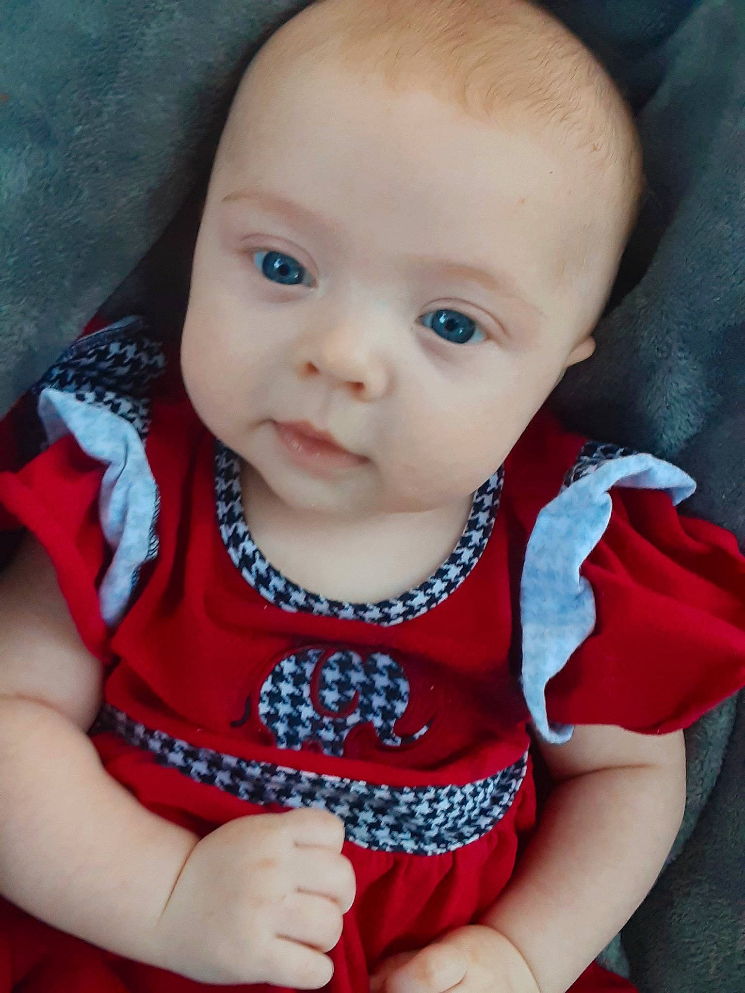 Diana is registered to the contest to win money with this photo: arm, baby, baby_toddler_clothing, cheek, chin, collar, dress, eye, face, facial_expression, finger, iris, lip, nose, outerwear, person, pink, product, skin, sleeve