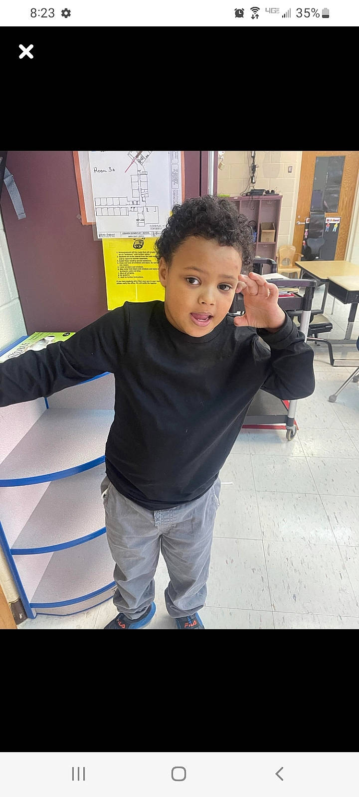 Zayden is registered to the contest to win money with this photo: automotive_design, chair, child, electric_blue, event, fashion_design, flooring, fun, happy, leisure, person, recreation, room, shoulder, sleeve, sportswear, t_shirt, toddler