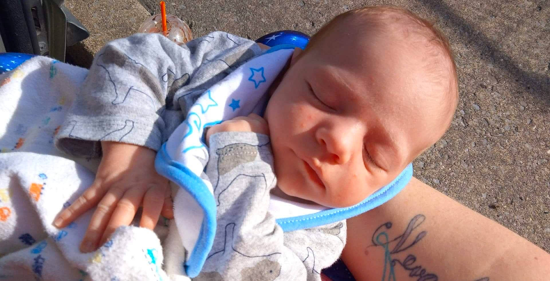 Noah is registered to the contest to win money with this photo: arm, azure, baby, baby_toddler_clothing, blue, cheek, chin, comfort, eye, eyelash, facial_expression, finger, hand, head, mouth, nose, organ, people, person, skin