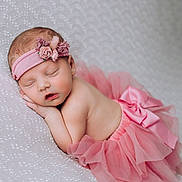 Leighton is registered to the contest to win money with this photo: baby, newborn, sleeping, pink, tutu, headband, flower, infant, cute, soft, portrait, child, peaceful, resting, blanket, adorable, small, delicate, skin, sleep