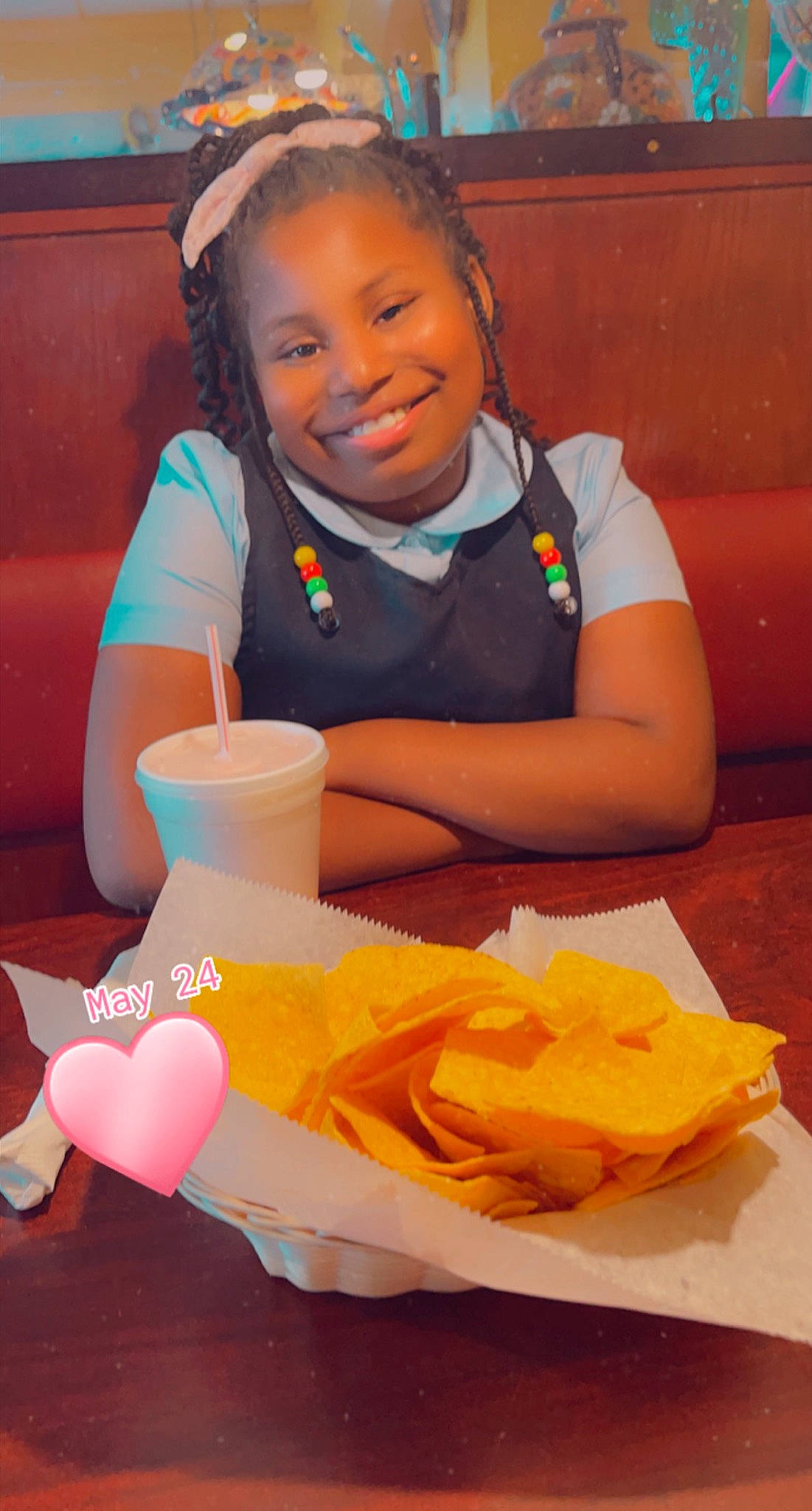 Amariah is registered to the contest to win money with this photo: chair, child, comfort_food, drinkware, fast_food, food, fun, happy, ingredient, joy, junk_food, leisure, orange, person, plate, recreation, sitting, smile, sweetness, t_shirt