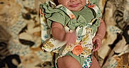 O'Dyssey joined the competition — help win amazing prizes! baby, blanket, cat_print, child, cozy, cute, expression, floral_pattern, footwear, green_clothing, happy, indoors, infant, lying_down, patterned_blanket, playful, portrait, small_shoes, smile, young_child