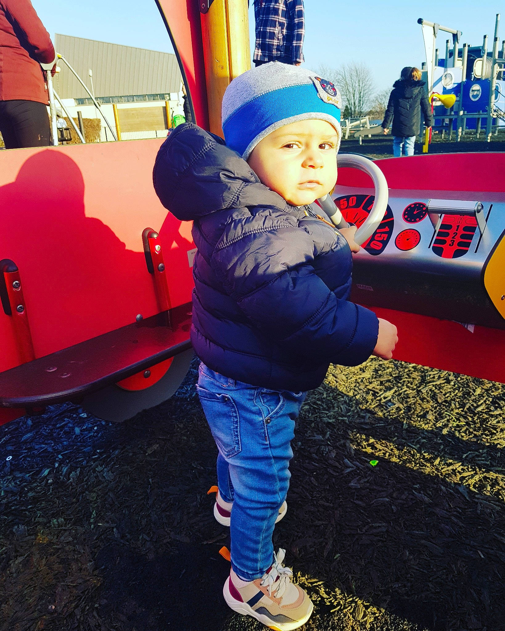 Eduard is registered to the contest to win money with this photo: beanie, cap, car, child, city, cool, electric_blue, fun, happy, human_settlement, jeans, outdoor_play_equipment, person, play, playground, public_space, recreation, sky, smile, toddler