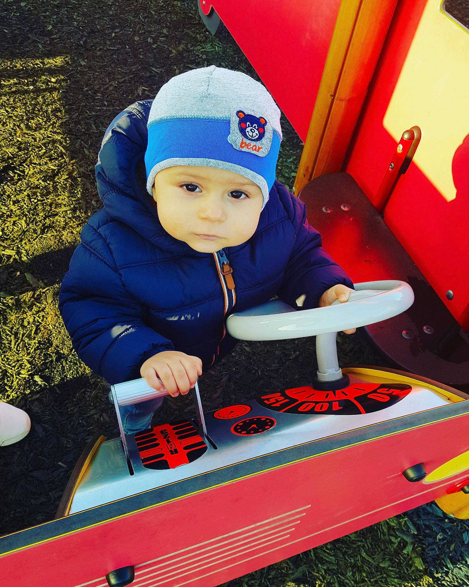 Eduard is registered to the contest to win money with this photo: beanie, cap, child, headgear, headwear, person, play, red, toddler