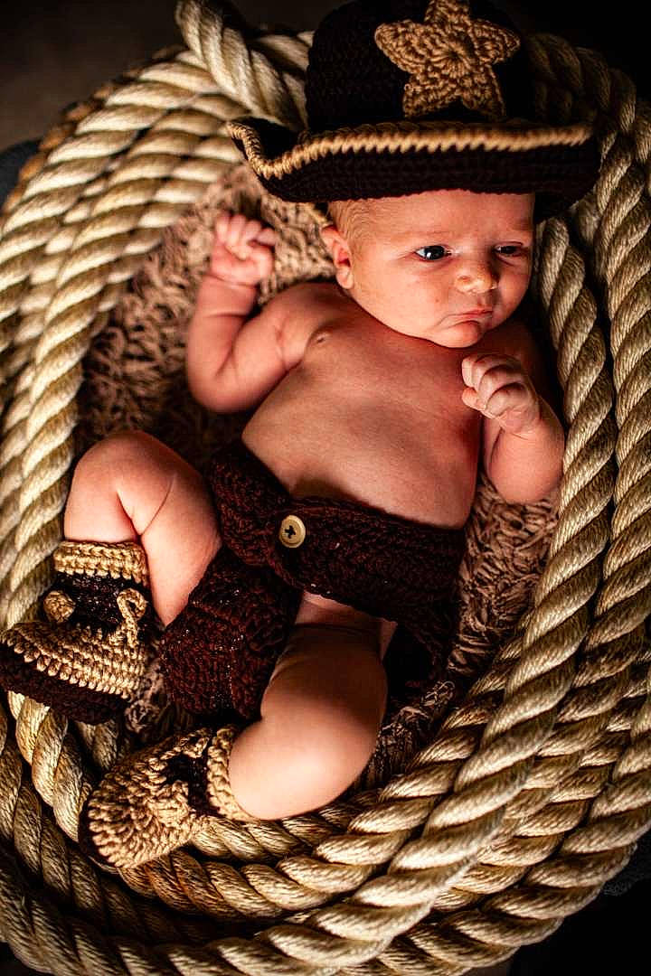Jase is registered to the contest to win money with this photo: baby, child, child_model, costume_accessory, cowboy_hat, eye, fashion_accessory, fur, hat, headgear, headwear, human_body, person, photography, skin, toddler, trunk