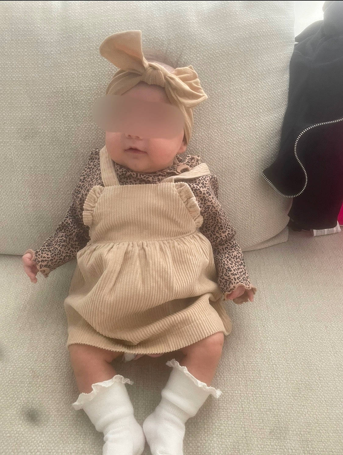Kayla participe au concours pour gagner de l'argent avec cette photo : baby, baby_toddler_clothing, child, doll, dress, fashion_accessory, flooring, head, human_leg, pattern, person, pink, product, skin, sleeve, stuffed_toy, textile, thigh, toddler, toy