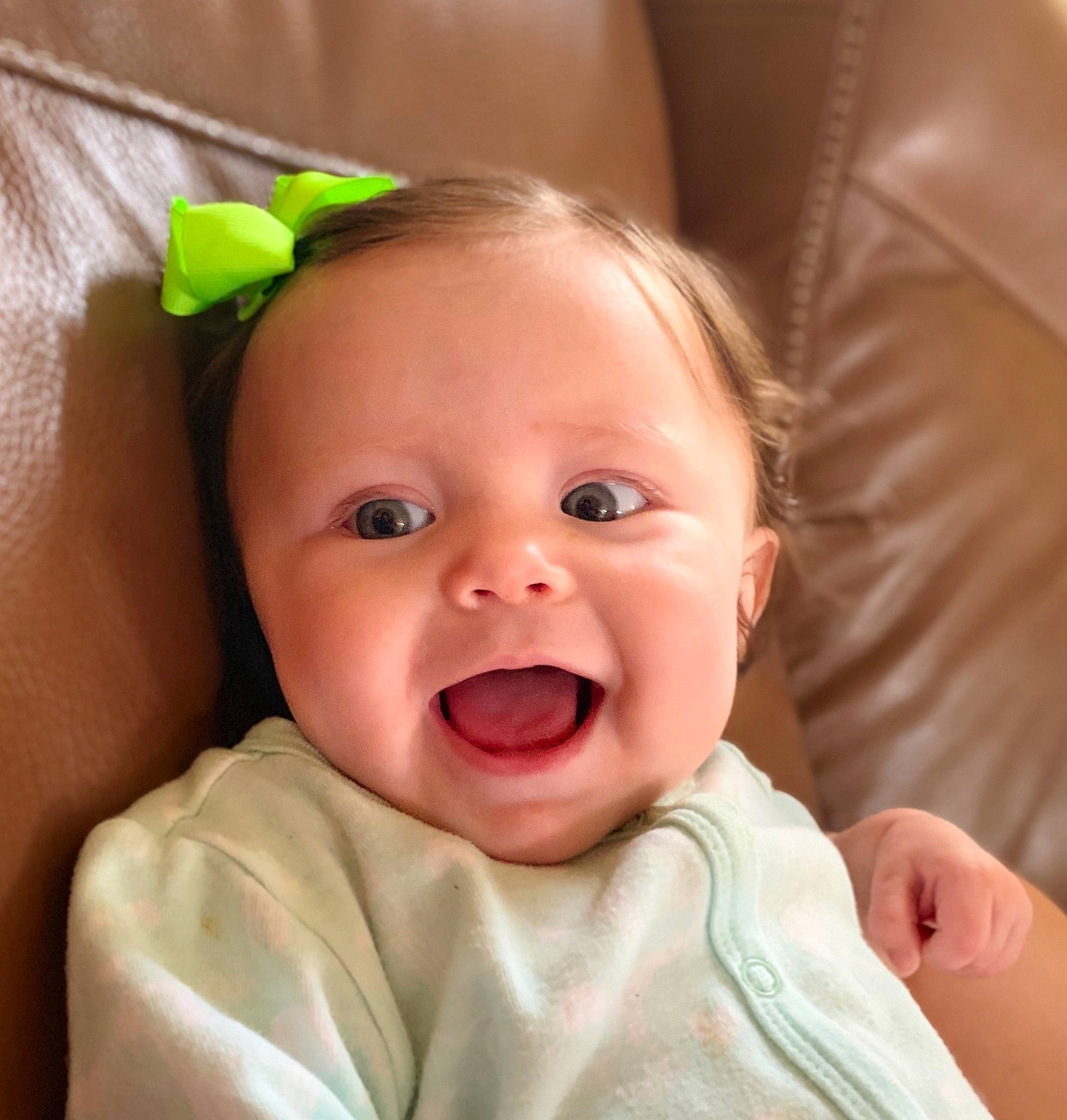 Elia is registered to the contest to win money with this photo: baby, baby_making_funny_faces, cheek, child, chin, close_up, ear, eye, face, facial_expression, finger, head, iris, laugh, lip, mouth, nose, person, skin, smile