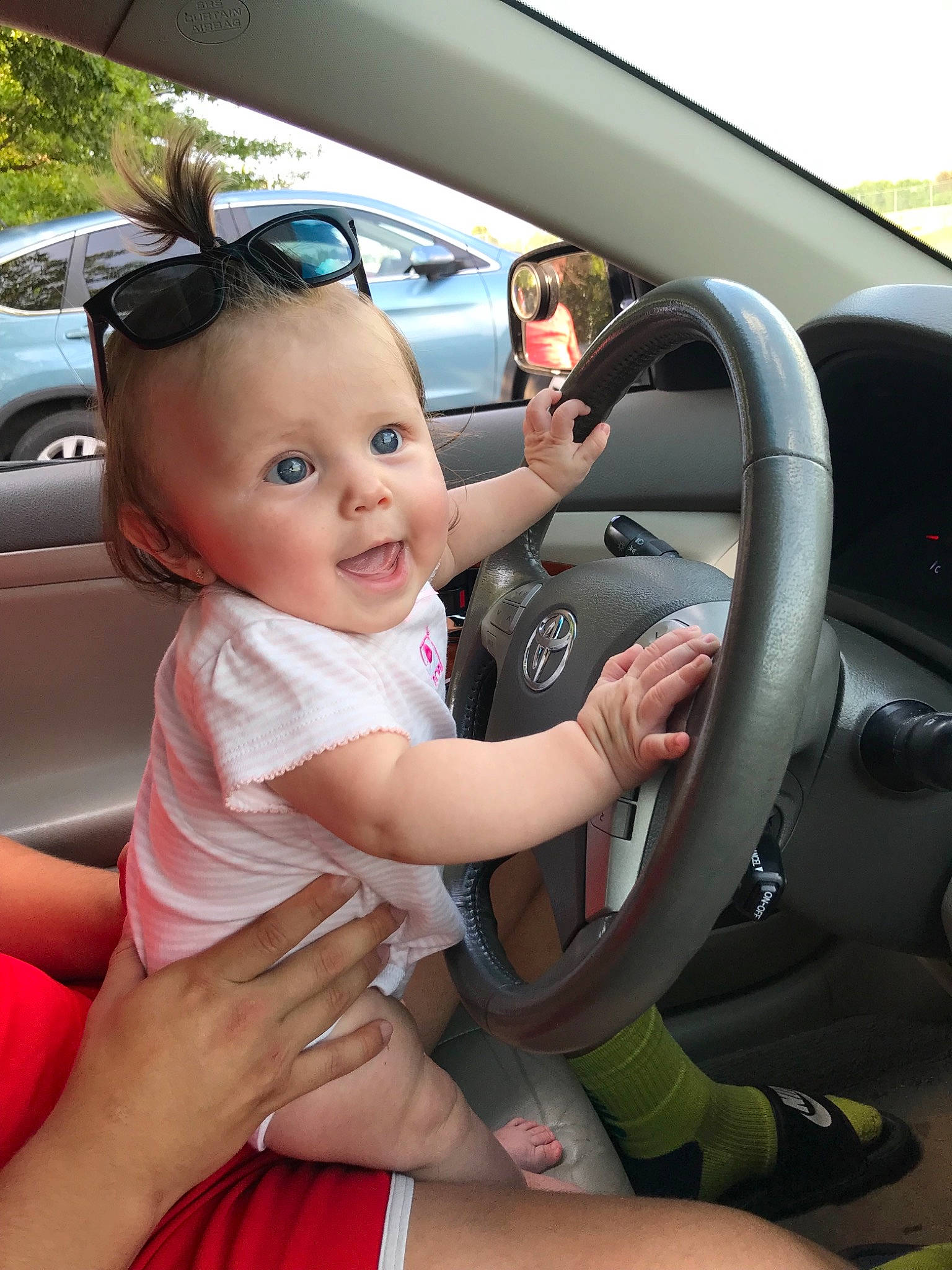 Elia joined the competition — help win amazing prizes! auto_part, baby, baby_in_car_seat, car, car_seat, child, city_car, driving, family_car, person, steering_part, steering_wheel, toddler, vehicle, vehicle_door