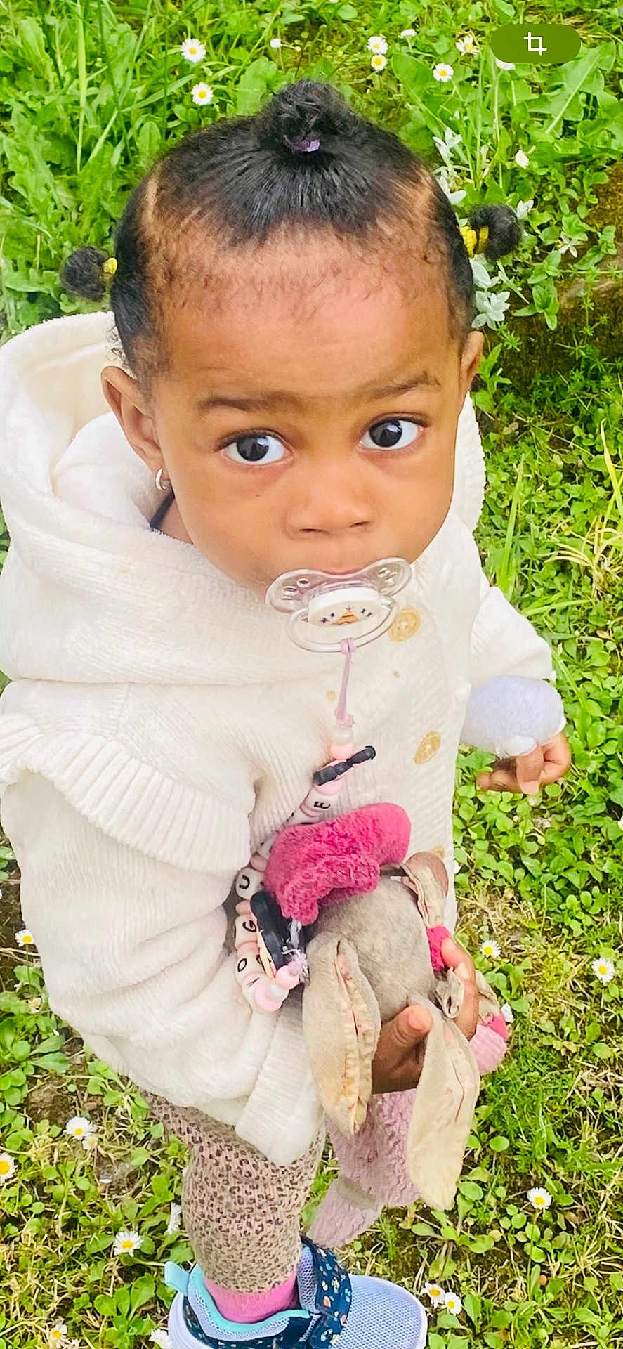 Voguene participe au concours pour gagner de l'argent avec cette photo : toddler, child, outdoor, grass, flowers, stuffed_toy, bunny, white_sweater, leggings, sneakers, pacifier, cute, young_child, nature, small_flowers, holding, looking_up, hair_tied, playful, innocent